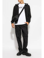 Image of Black Cargo Pants by Moncler for Men - Season Autumn-Winter 2024 - Model view 1