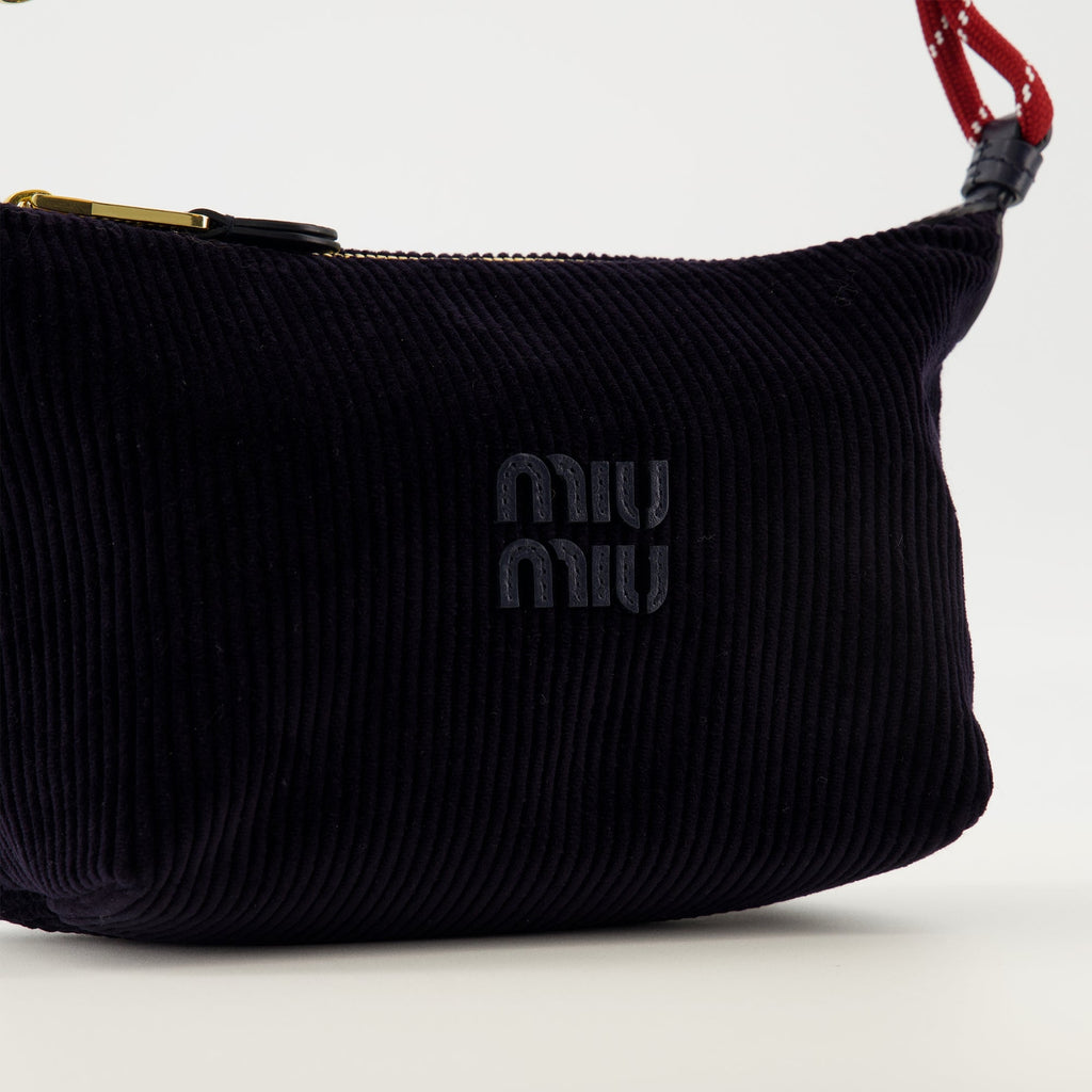 Image d'une trousse en velours côtelé bleu marine par Miu Miu pour femmes - Saison Printemps-Été 2026 - Détail 1