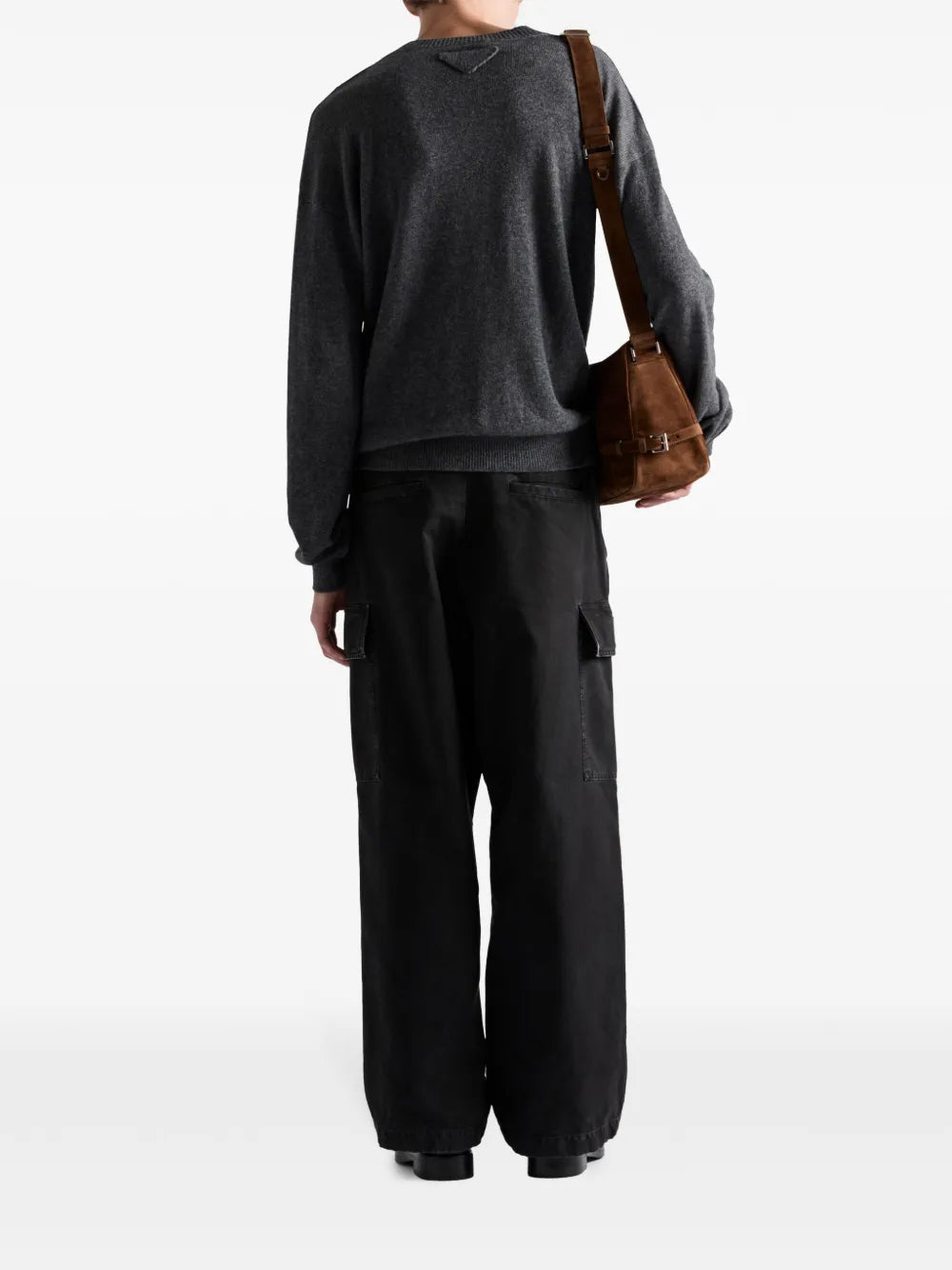 Image of Black Distressed Cargo Pants by Prada for Men - Season Spring-Summer 2025 - Model view 2