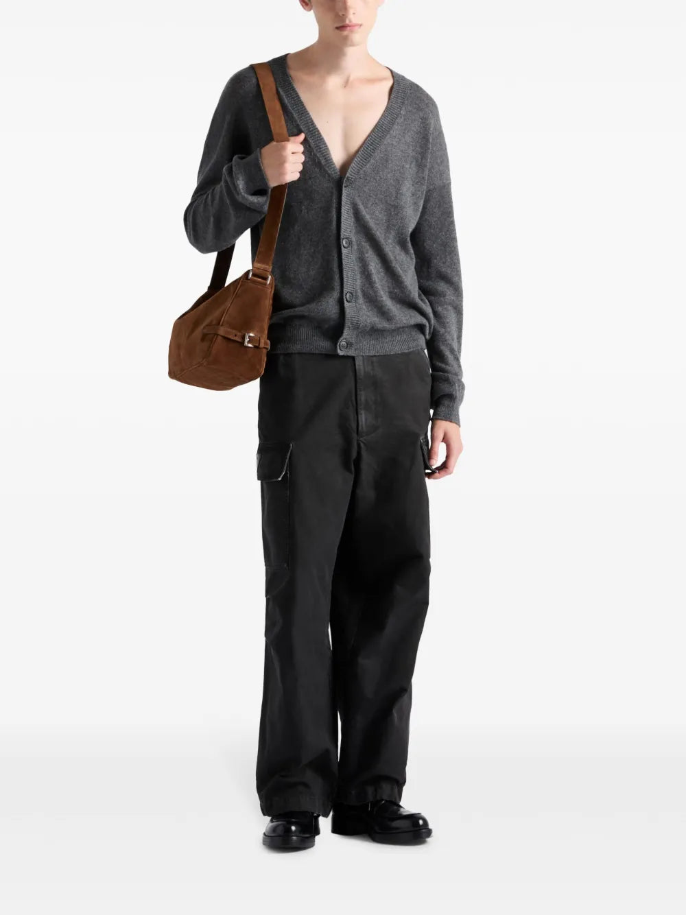 Image of Black Distressed Cargo Pants by Prada for Men - Season Spring-Summer 2025 - Model view 1