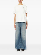 Image of Numeric White T-shirt by Mm6 for Women - Season Spring-Summer 2025 - Model view 1