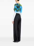 Image of Black Silk Pants with Elastic Waist by Mm6 for Women - Season Spring-Summer 2025 - Model view 5