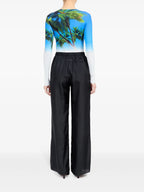 Image of Black Silk Pants with Elastic Waist by Mm6 for Women - Season Spring-Summer 2025 - Model view 3