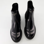 Image of Patent Leather Ankle Boots by Prada for Women - Season Autumn-Winter 2024 - Front Right Three-Quarter View