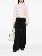 Image of Petra Pink Puffer Jacket by Moncler for Women - Season Autumn-Winter 2025 - Model view 1