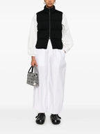 black sleeveless jacket, Moncler, contemporary design, women's outerwear, nylon jacket