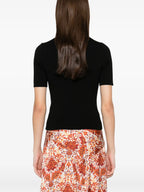 Image of Black wool sweater with gold chain by Rabanne for Women - Season Spring-Summer 2025 - Model view 3