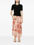 Image of Black wool sweater with gold chain by Rabanne for Women - Season Spring-Summer 2025 - Model view 1