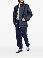 Image of Navy Sweatpants by Moncler for Men - Season Spring-Summer 2025 - Model view 1