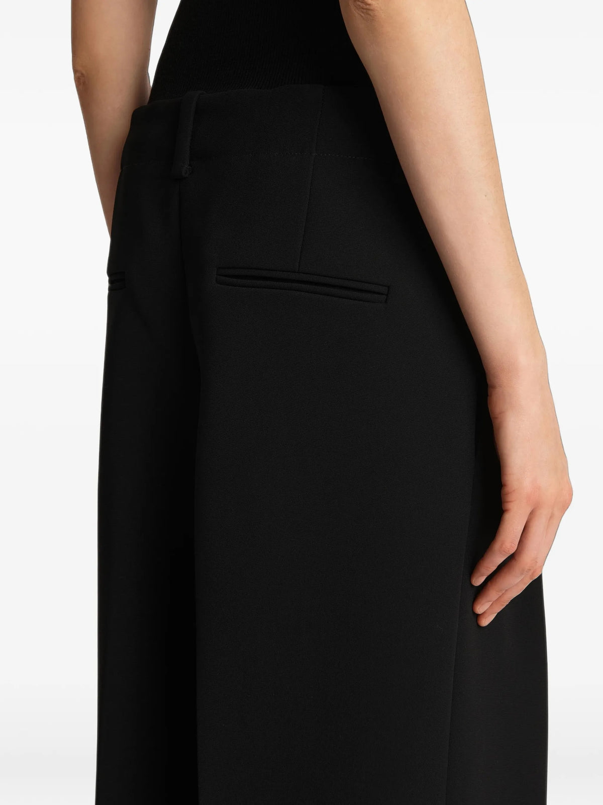 Image of Black Lenton Trousers by Khaite for Women - Season Spring-Summer 2025 - Model View 5