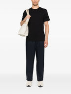 Image of Black Logo T-Shirt by Moncler for Men - Season Autumn-Winter 2025 - Model view 1