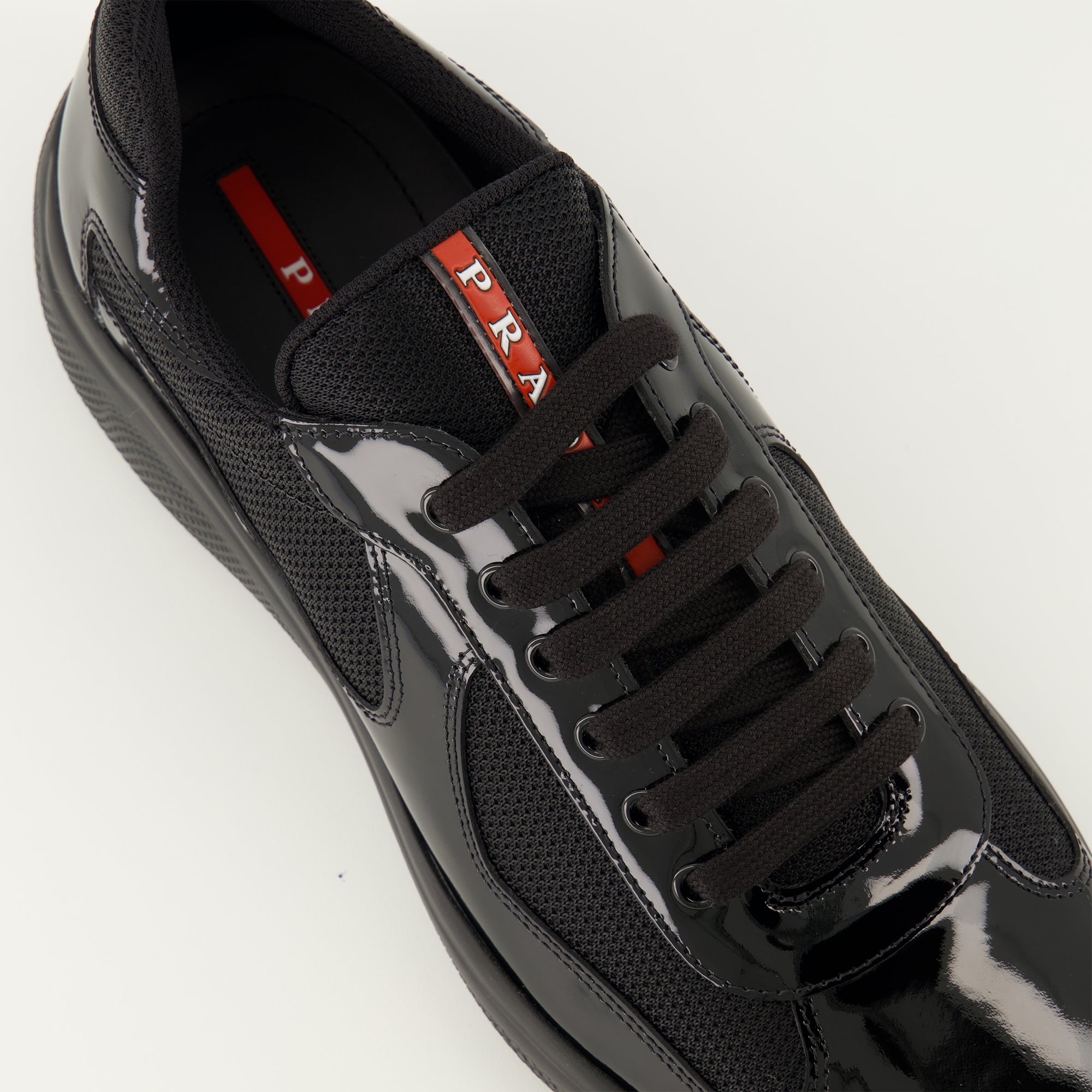 Prada sneakers, black calfskin shoes, sporty footwear, luxury lifestyle, designer sneakers