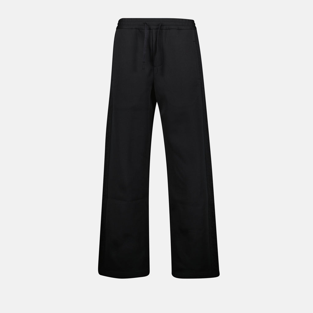 Oblique jogger pants, drawstring waist, embroidered logo, side motif, piped pockets