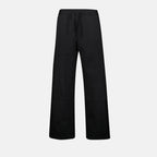 Oblique jogger pants, drawstring waist, embroidered logo, side motif, piped pockets