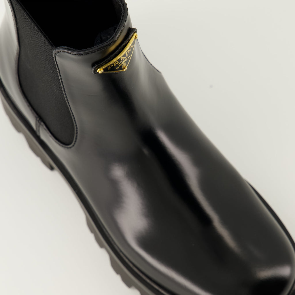 Prada ankle boots, black leather boots, Autumn-Winter 2025, slip-on design, rubber tread sole