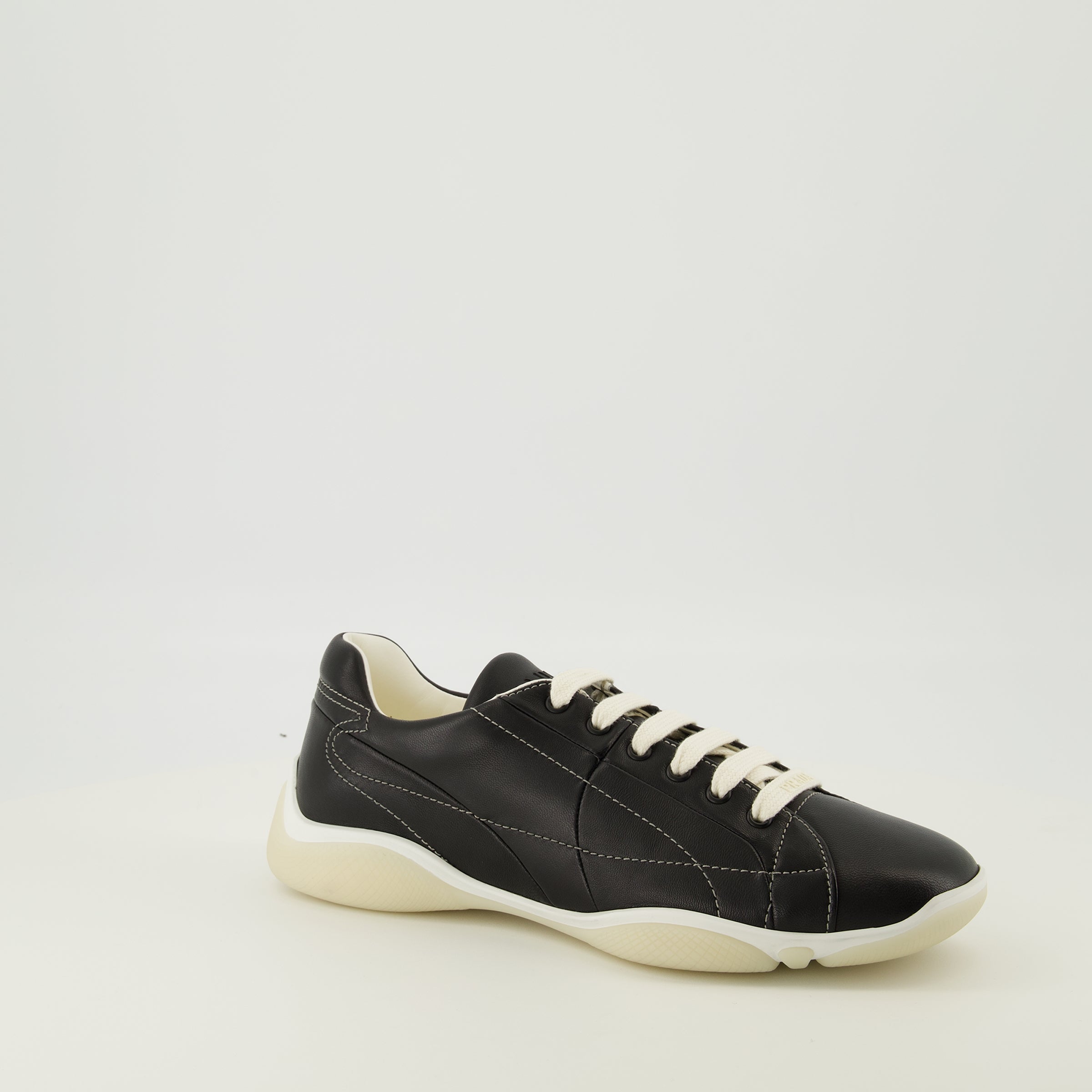 Prada sneakers, black leather footwear, comfort sneakers, rubber sole shoes, stylish lace-up shoes
