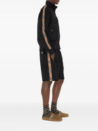 Image of Black Cotton Track Jacket by Burberry for Men - Season Autumn-Winter 2025 - Model view 2