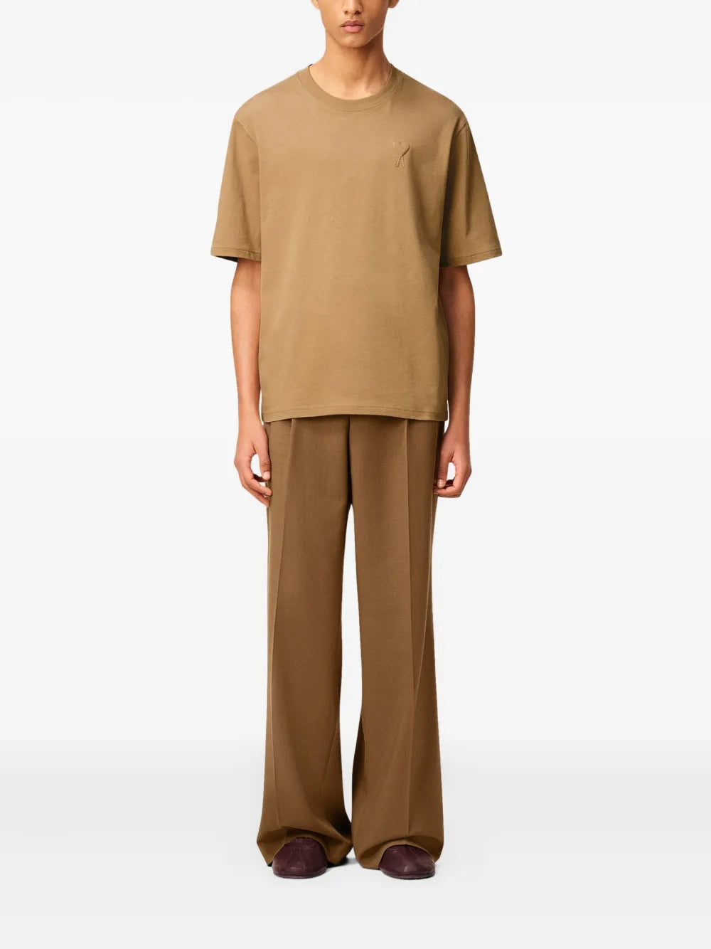 Image of Brown Cotton T-Shirt by Ami PARIS for Unisex - Season Autumn-Winter 2025 - Model view 1