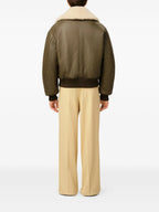 Image of AMI Paris Kaki Leather Jacket by Ami PARIS for Men - Season Autumn-Winter 2025 - Model view 3