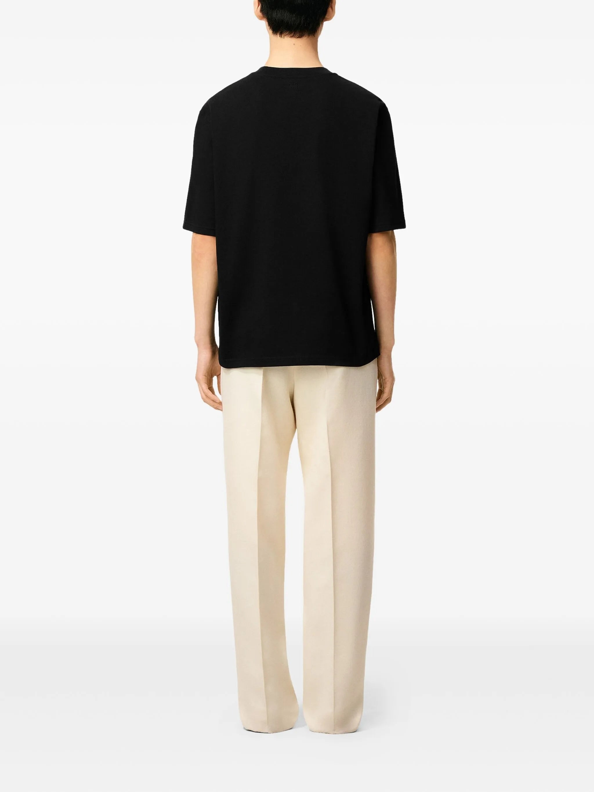 Image of Black Cotton T-Shirt by Ami PARIS for Unisex - Season Spring-Summer 2026 - Model view 3