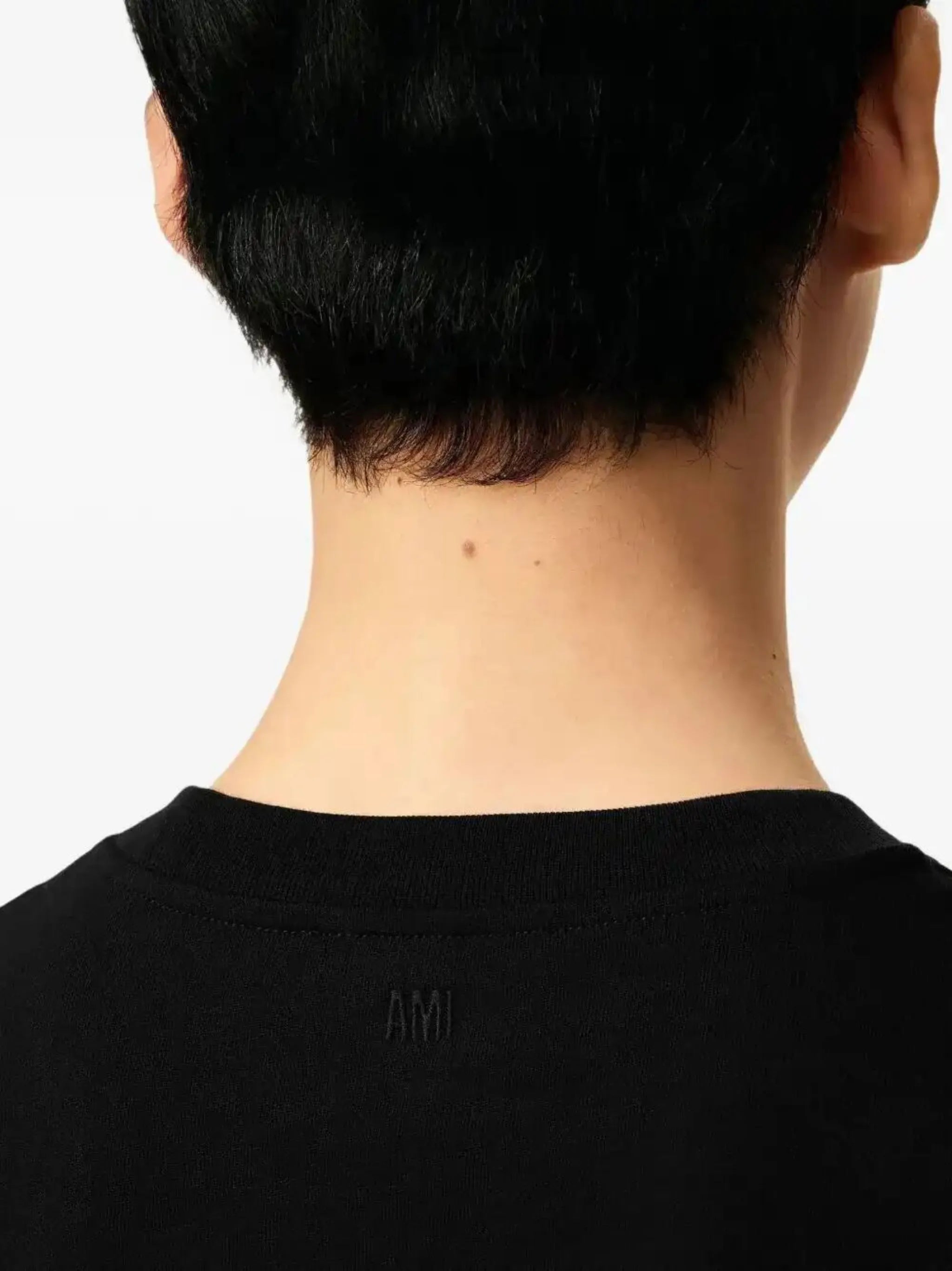 Image of Black Cotton T-Shirt by Ami PARIS for Unisex - Season Spring-Summer 2026 - Model view 5