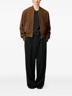 Image of Brown Suede Bomber Jacket by Ami PARIS for Men - Season Autumn-Winter 2025 - Model view 1