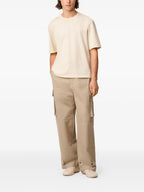 Image of Beige Cargo Pants by Ami PARIS for Men - Season Autumn-Winter 2025 - Back View