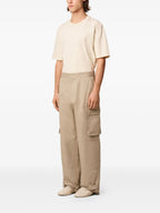 Image of Beige Cargo Pants by Ami PARIS for Men - Season Autumn-Winter 2025 - Detail View 1