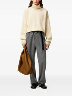 Image of Ami de coeur Roll Neck Sweater by Ami PARIS for Women - Season Fall - Winter 2025 - Model view 1