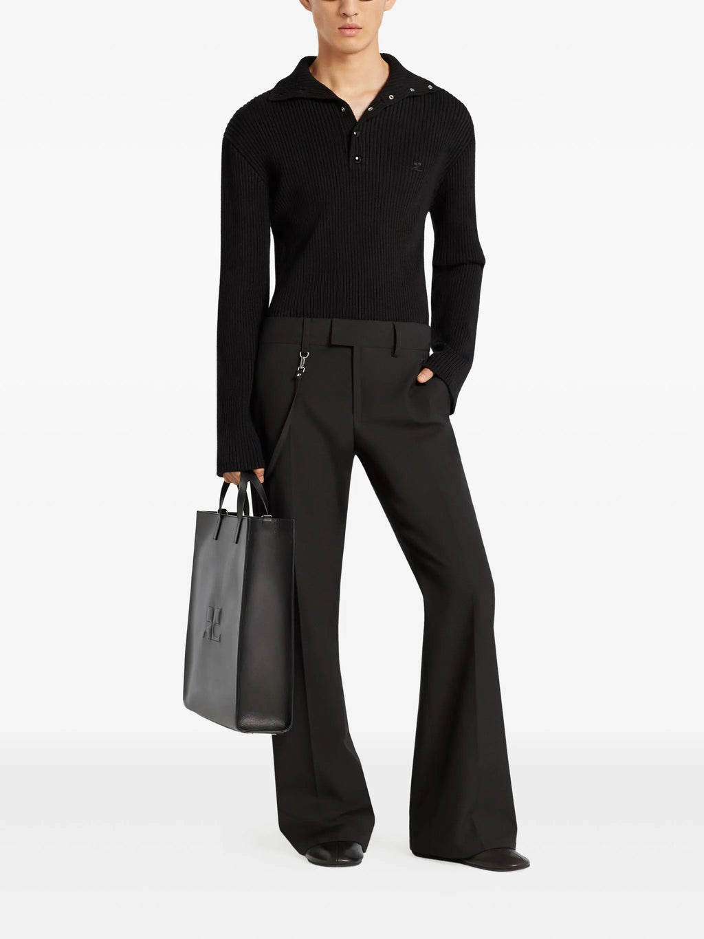 Image of Black Wool Polo by Courrèges for Men - Season Autumn-Winter 2025 - Model view 1