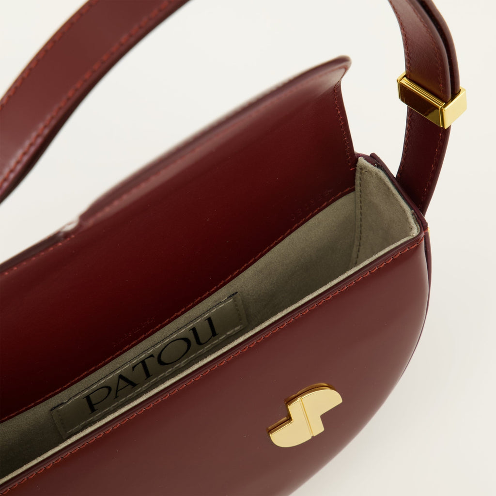 Le Petit Patou bag, bordeaux handbag, half-moon bag, high-quality leather bag, adjustable shoulder strap