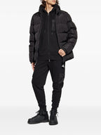 Image of Black Jogging Pants by Moncler for Men - Season Autumn-Winter 2025 - Model view 1