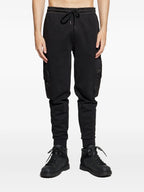 Image of Black Jogging Pants by Moncler for Men - Season Autumn-Winter 2025 - Model view 2