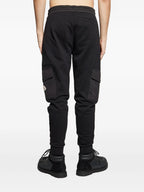 Image of Black Jogging Pants by Moncler for Men - Season Autumn-Winter 2025 - Model view 3