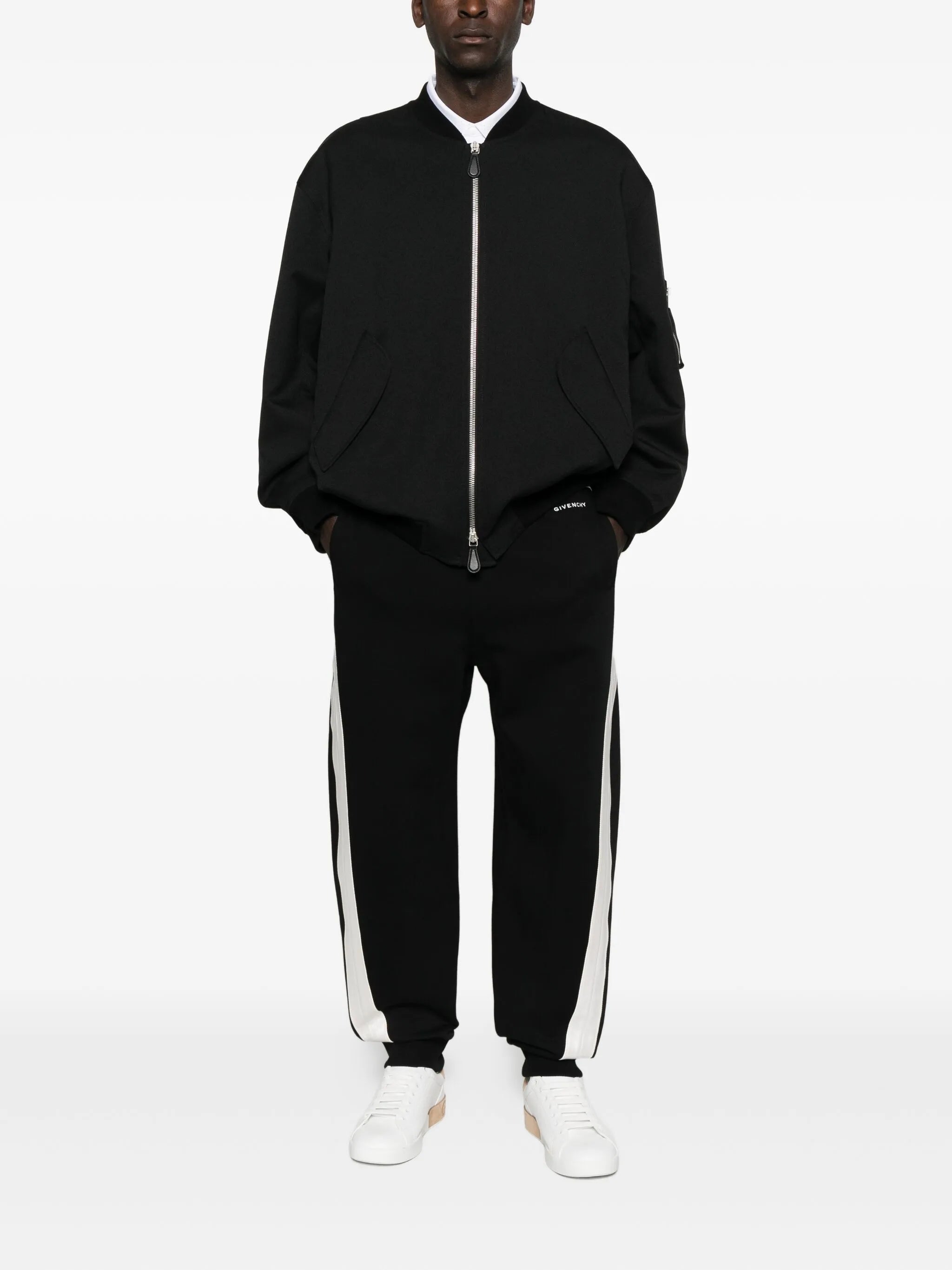 Image of Black Jogging Pants by Givenchy for Men - Season Autumn-Winter 2025 - Model View 1