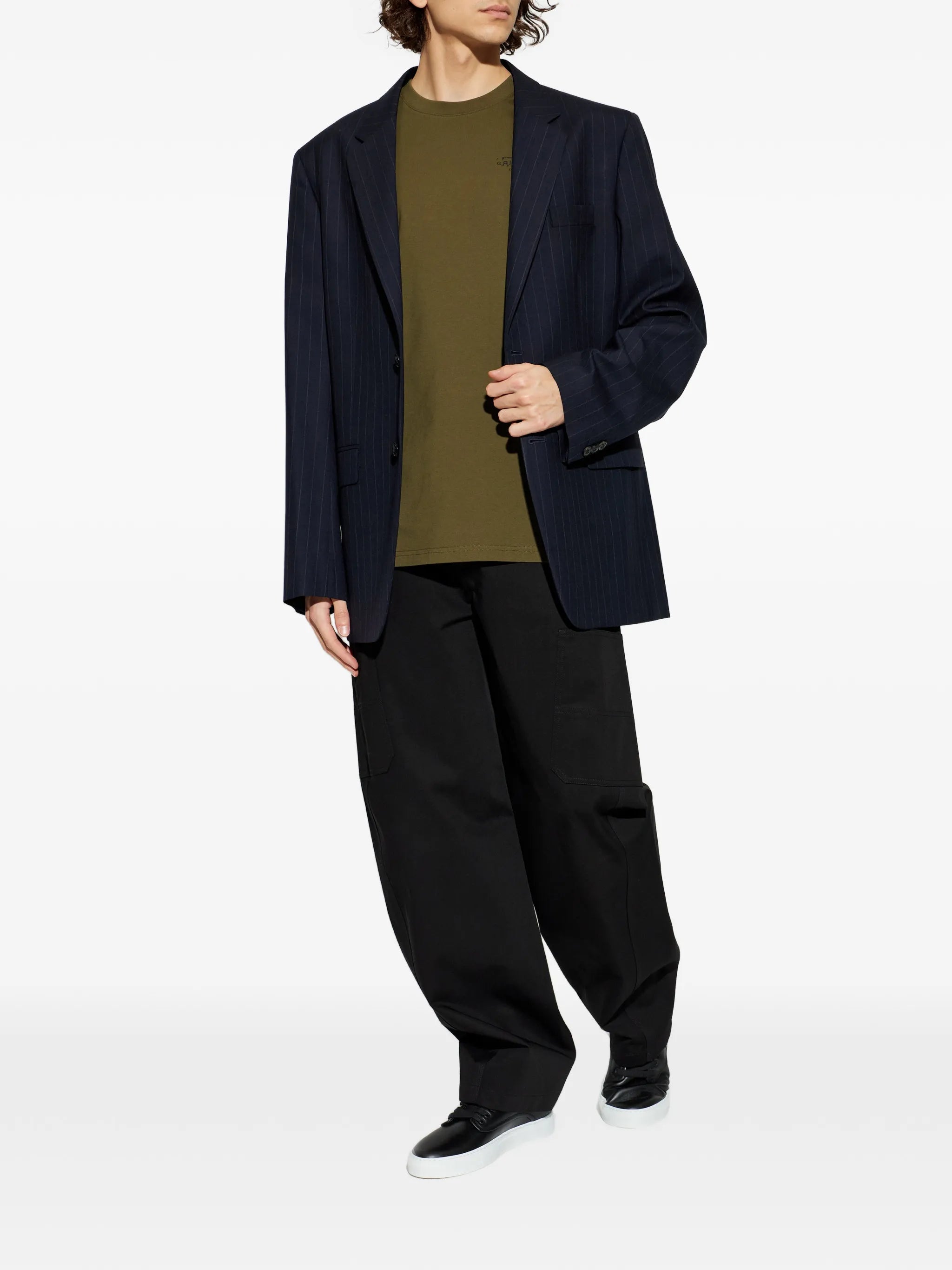 Image of Givenchy Kaki Stamp T-Shirt by Givenchy for Men - Season Spring-Summer 2026 - Model view 1