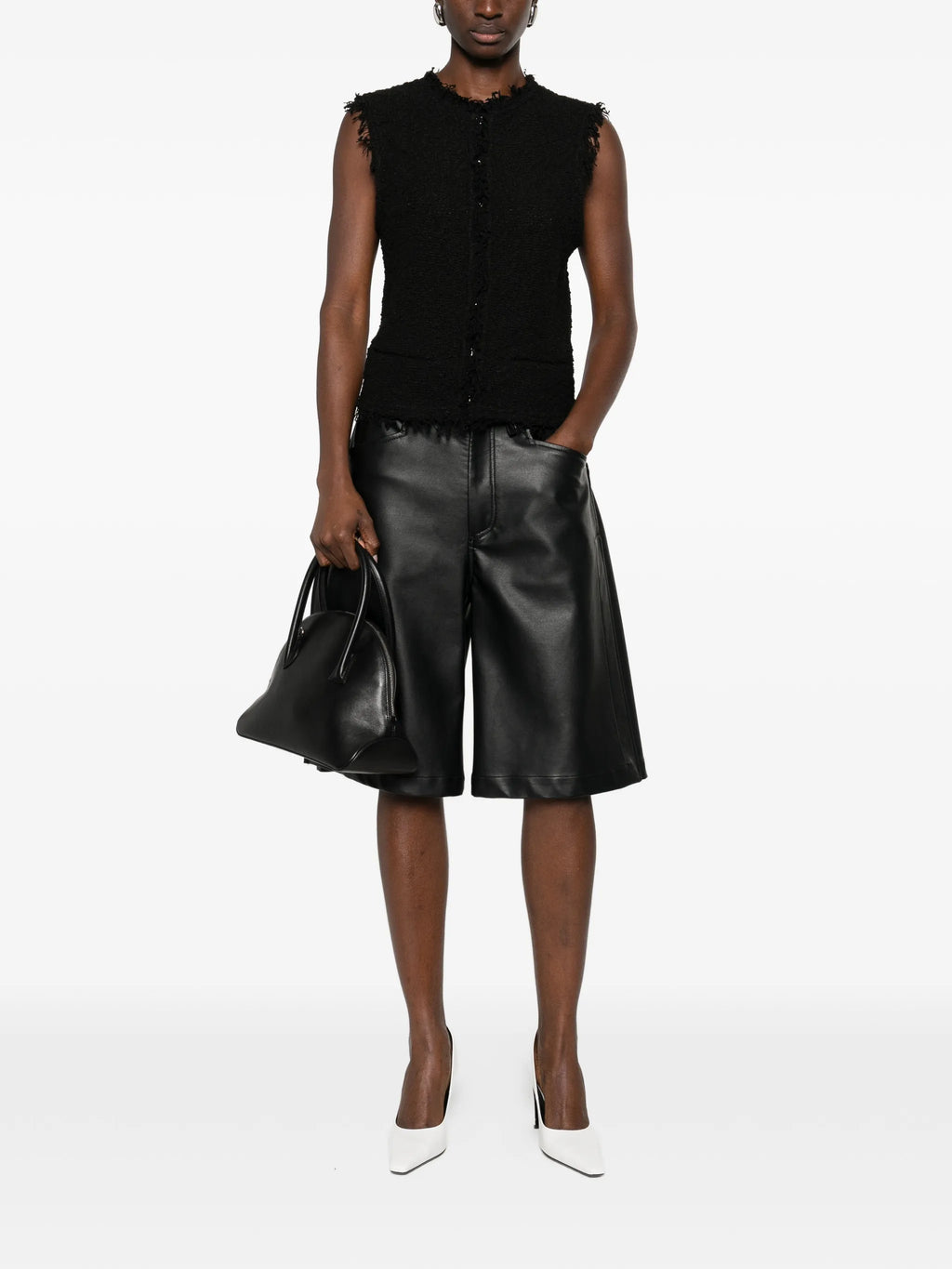 Image of Black Tweed Sleeveless Jacket by Iro for Women - Season Spring-Summer 2026 - Model View 1