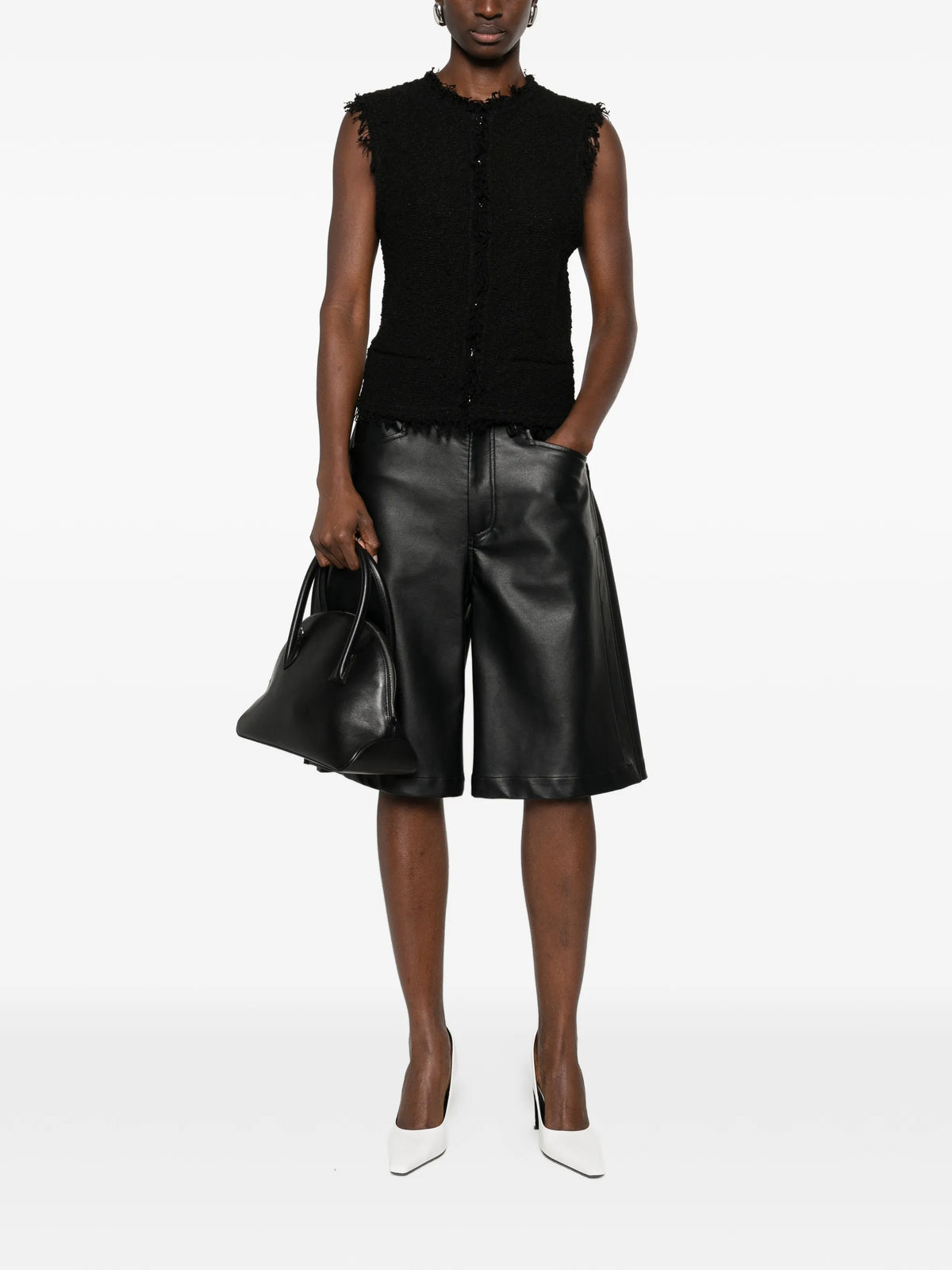 Image of Black Tweed Sleeveless Jacket by Iro for Women - Season Spring-Summer 2026 - Model View 1