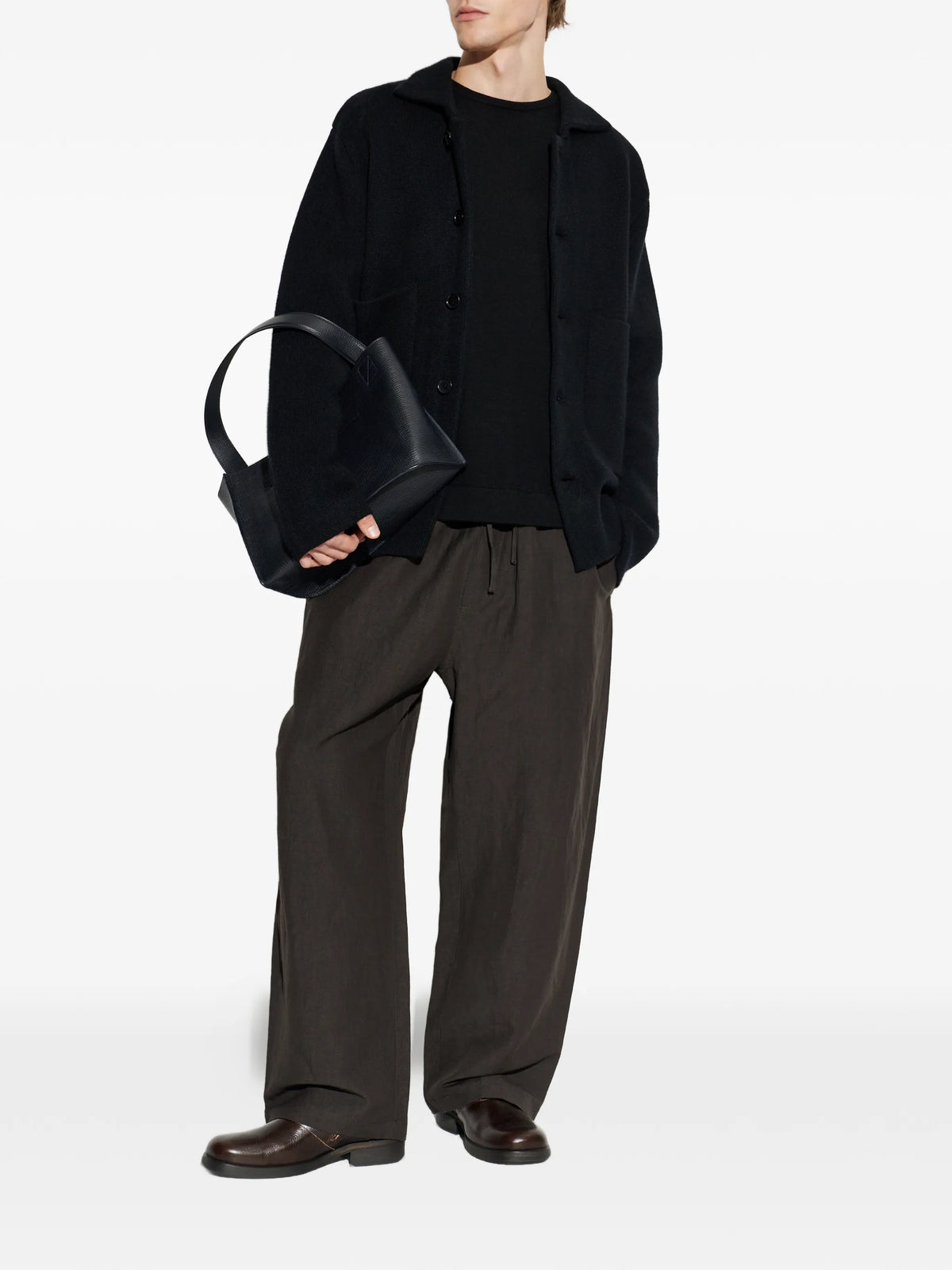 Image of Black Wool Sweater by Officine Générale for Unisex - Season Autumn-Winter 2026 - Model View 1