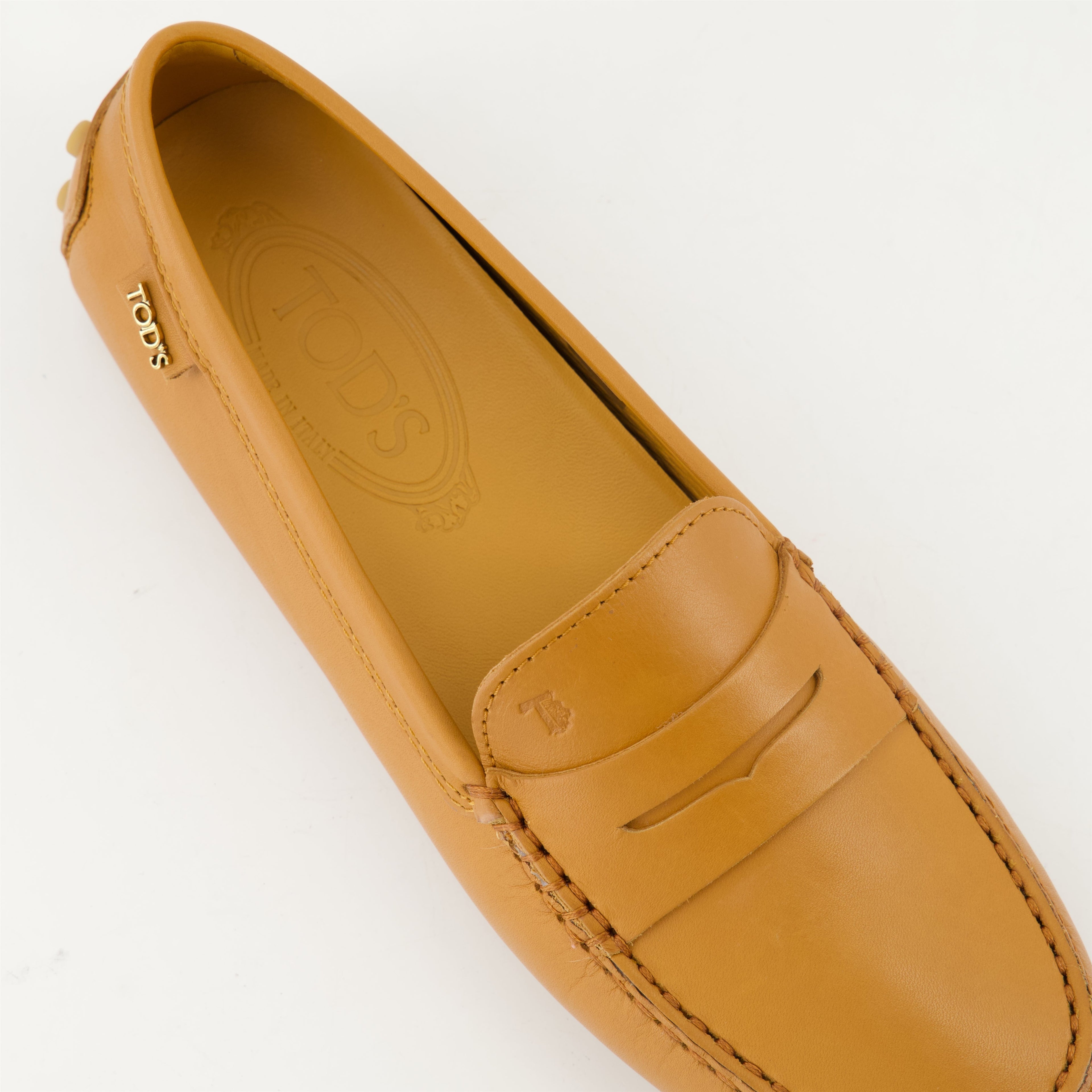 Tod's loafers, Gommino loafers, leather footwear, luxury loafers, brown leather shoes