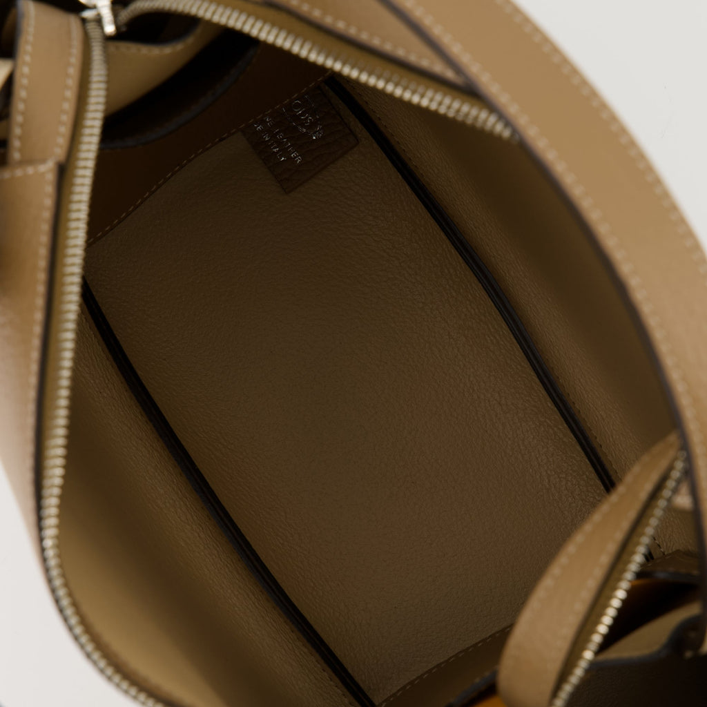 brown leather bag, Tod's Bauletto, stylish handbag, calf leather accessory, versatile bag