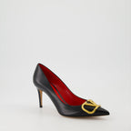   Valentino Garavani, black leather pumps, pointed-toe shoes, high-end fashion, luxury footwear