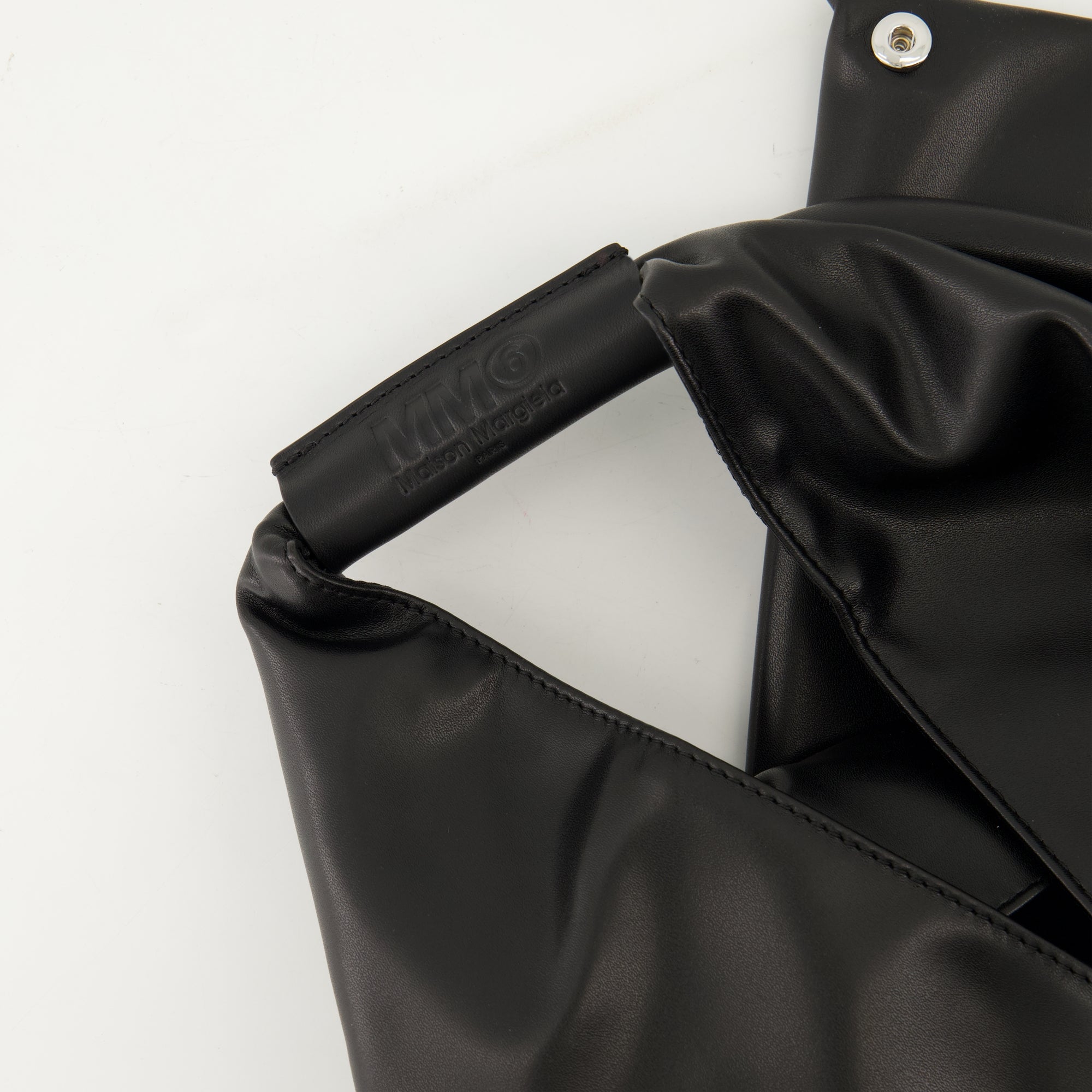 black leather bag, triangular bag, MM6 accessories, Autumn Winter 2025 collection, designer tote