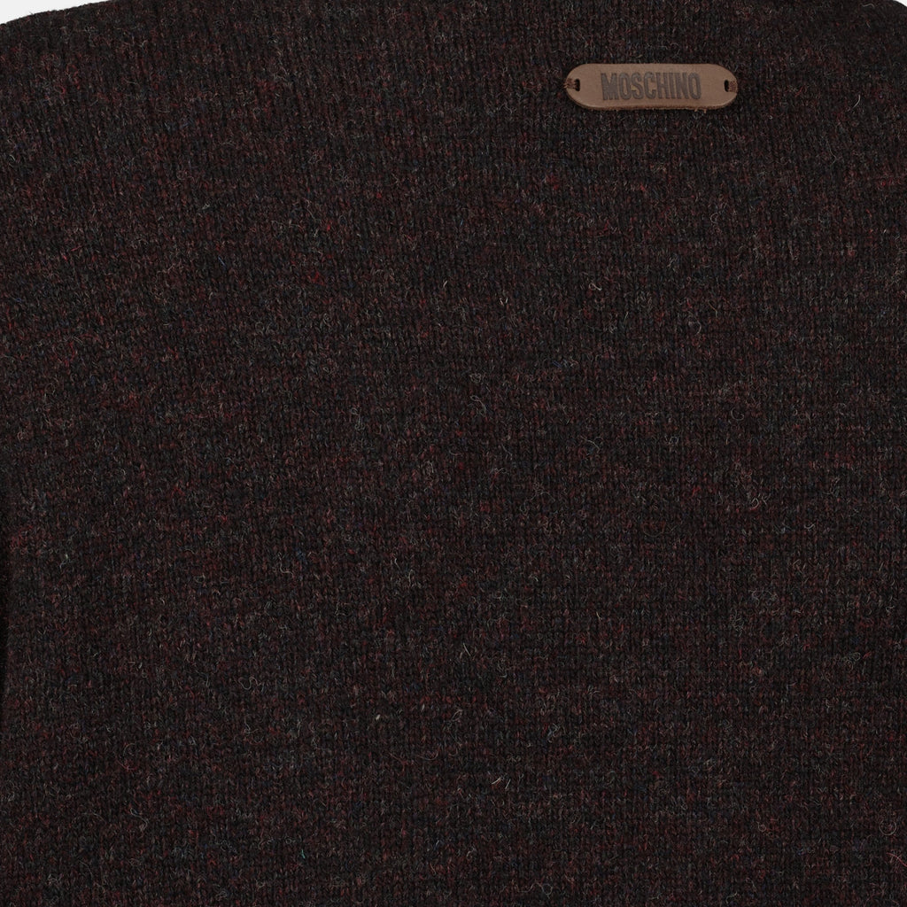 brown wool sweater, Moschino fashion, Fall-Winter 2025 collection, distressed effect clothing, luxury knitwear