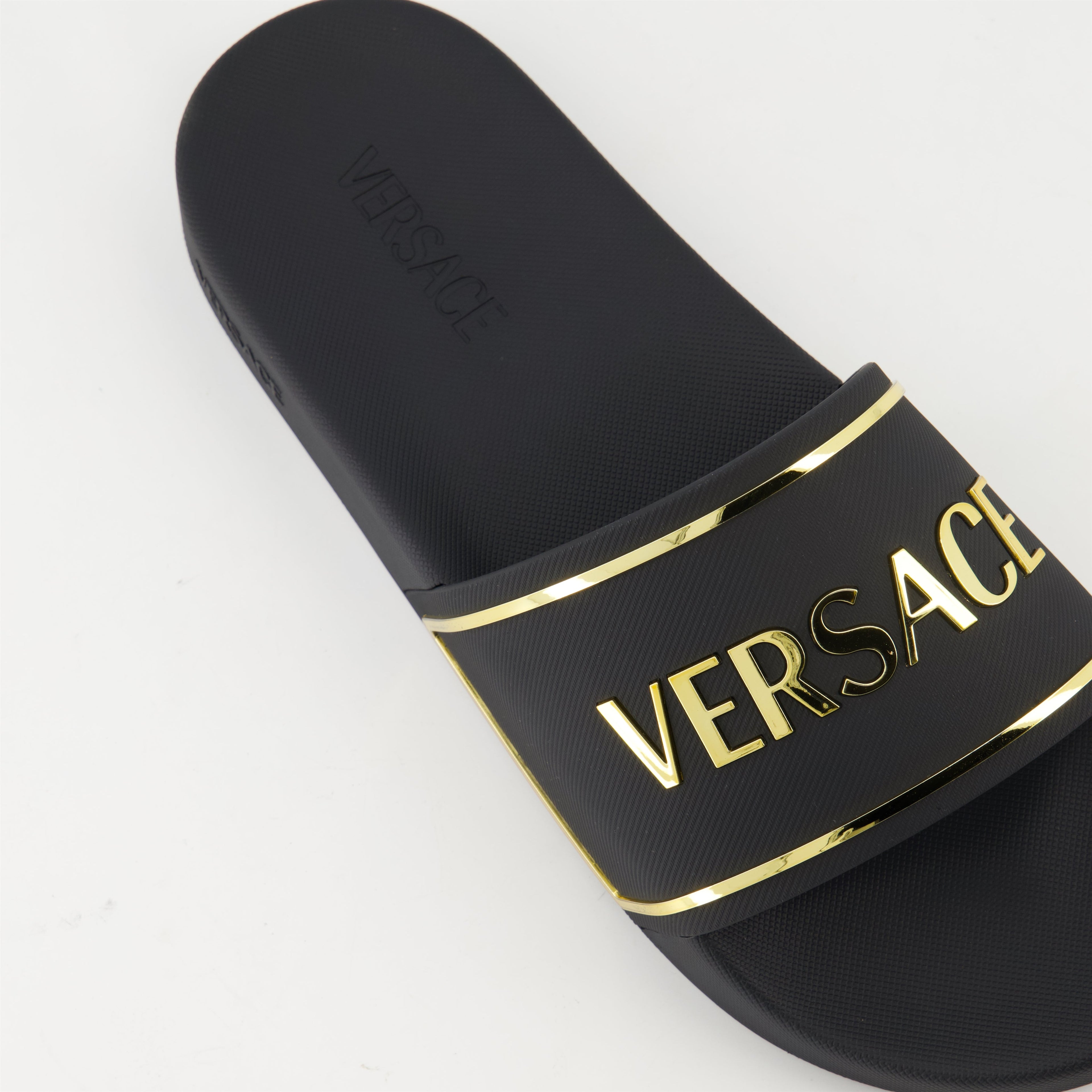 gold logo slides, Versace slides, comfortable rubber footwear, contemporary slides, stylish casual footwear