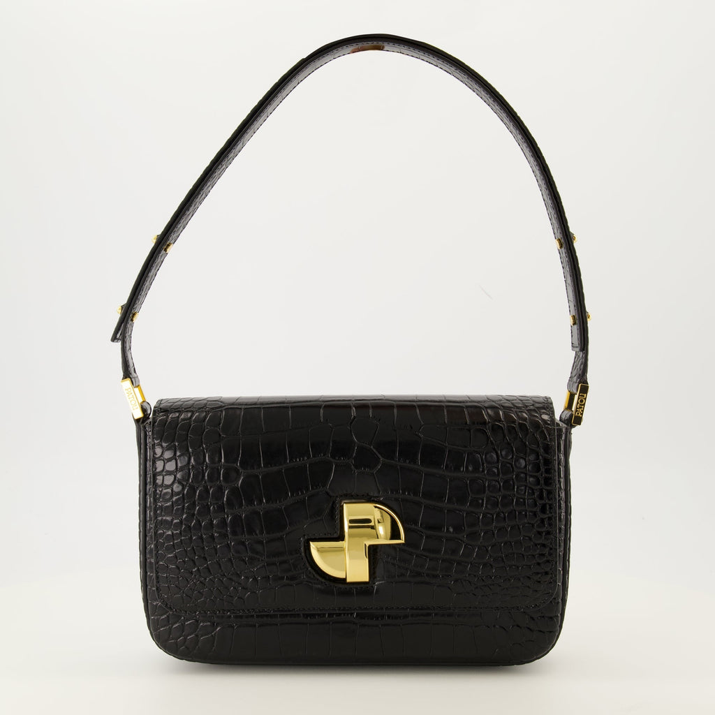 Patou handbag, croco-effect leather bag, elegant black handbag, Art Deco clasp, adjustable handle handbag