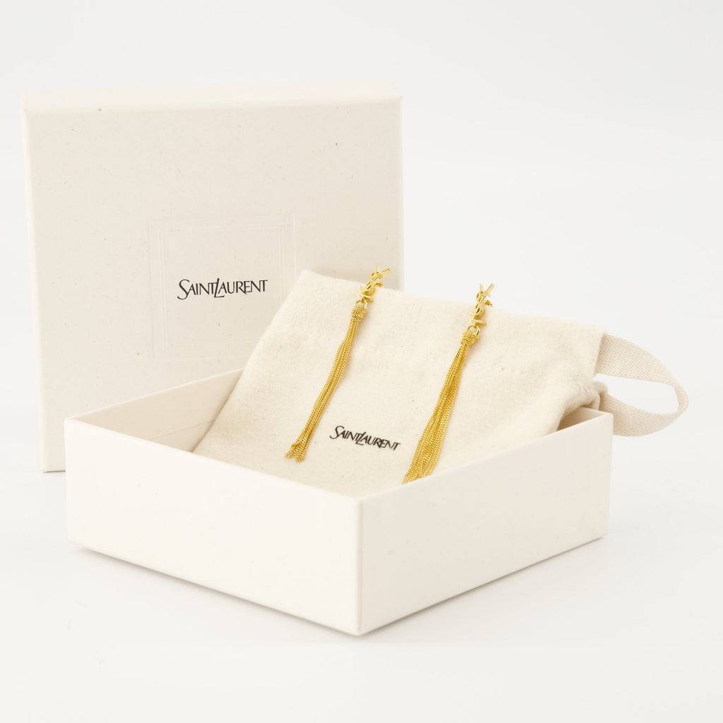 Cassandre earrings, Saint Laurent jewelry, gold earrings, elegant accessories, brass earrings