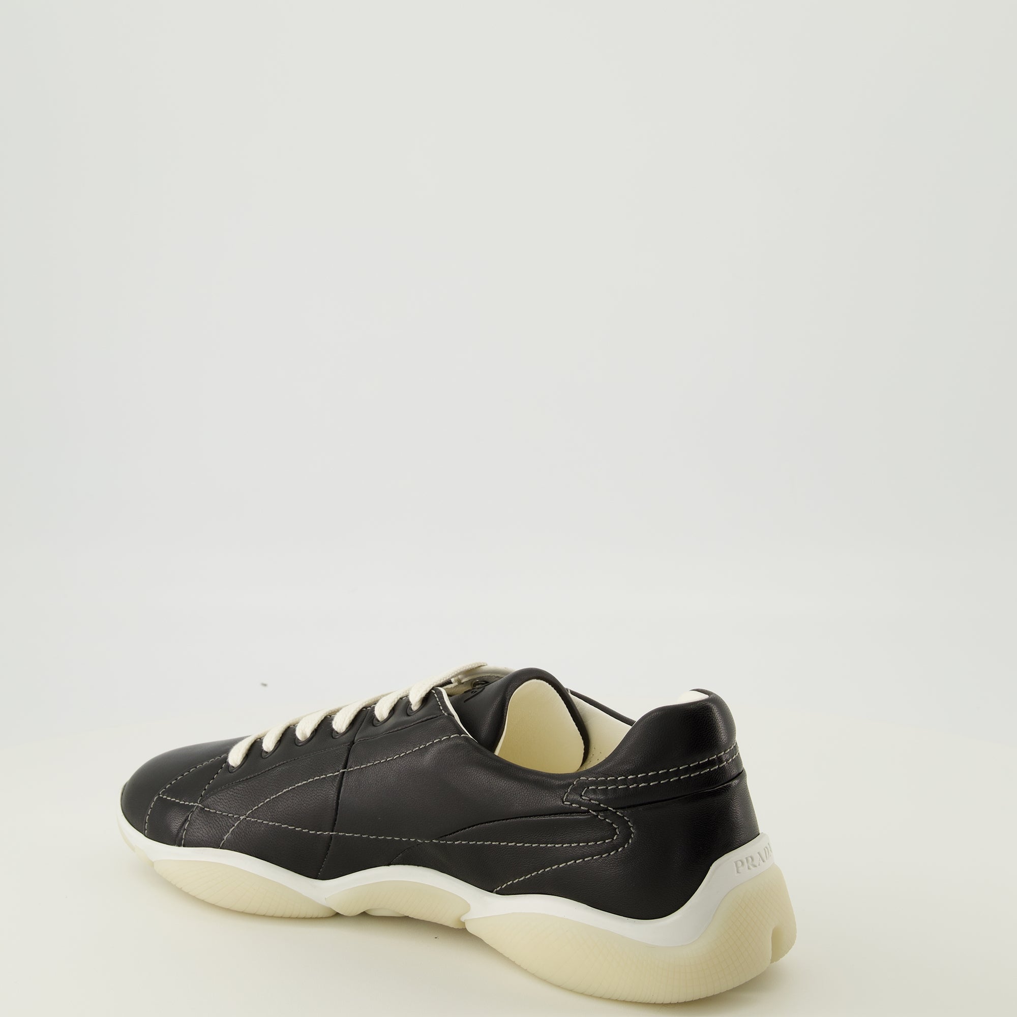 Prada sneakers, black leather footwear, comfort sneakers, rubber sole shoes, stylish lace-up shoes