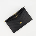 black cardholder, Saint Laurent, textured leather accessory, YSL logo, luxury cardholder