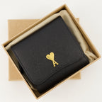 black wallet, AMI Paris, grained leather wallet, snap closure, card slots